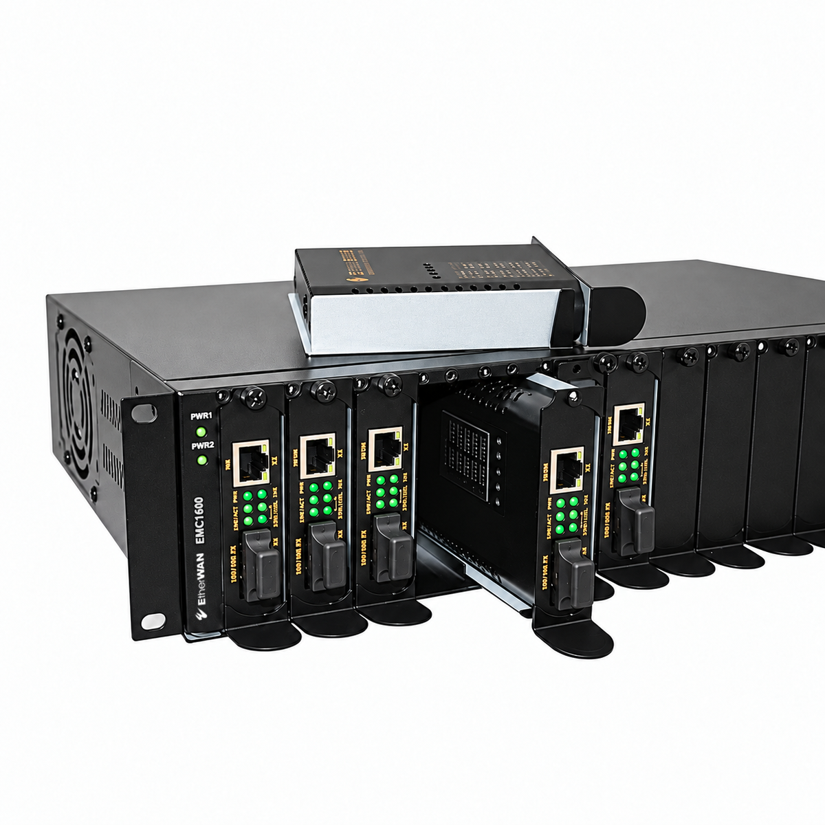 EtherWAN EMC1600 rack chassis with installed fiber media converters, one partially withdrawn converter, and another resting on top.
